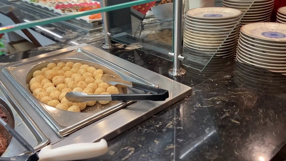 Tray-lined buffet setup for lunch service.
