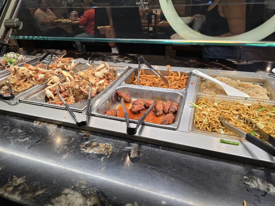 Printed menu with rice, noodles, and appetizers.