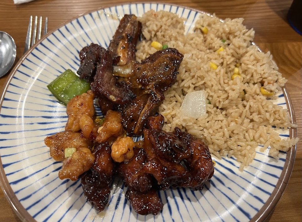 Printed menu with rice, noodles, and appetizers.